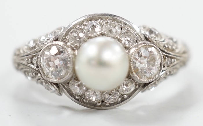 A white metal(stamped Platin), cultured pearl and diamond set circular cluster ring, size M, gross weight 5 grams.